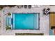 Refreshing pool with a spa and surrounding stone patio at 2514 Beach S Blvd, Gulfport, FL 33707