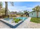 Relaxing backyard oasis featuring a pool, spa, and patio area at 2514 Beach S Blvd, Gulfport, FL 33707