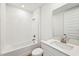 Clean bathroom with white vanity and bathtub at 13855 Richland Gulf Cir, Parrish, FL 34219