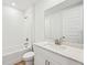 Clean bathroom with white vanity and bathtub at 13855 Richland Gulf Cir, Parrish, FL 34219