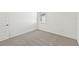 Simple bedroom with carpet flooring and window at 13855 Richland Gulf Cir, Parrish, FL 34219