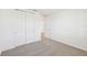 Bright bedroom with double door closet and carpet flooring at 13855 Richland Gulf Cir, Parrish, FL 34219