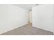 Bedroom with carpeted floor and access to hallway at 13855 Richland Gulf Cir, Parrish, FL 34219