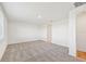Large bedroom with carpeted floor and access to bathroom at 13855 Richland Gulf Cir, Parrish, FL 34219