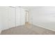 Bright bedroom with double door closet and carpet flooring at 13855 Richland Gulf Cir, Parrish, FL 34219