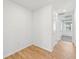 Simple bedroom with wood-look tile flooring and door at 13855 Richland Gulf Cir, Parrish, FL 34219