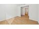 Light-filled hallway with wood-look tile flooring at 13855 Richland Gulf Cir, Parrish, FL 34219