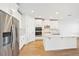 Modern kitchen with island, stainless steel appliances, and white cabinets at 13855 Richland Gulf Cir, Parrish, FL 34219