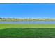Scenic view of lake from covered patio at 13855 Richland Gulf Cir, Parrish, FL 34219
