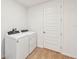Laundry room with washer and dryer, and door at 13855 Richland Gulf Cir, Parrish, FL 34219