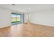 Living room with tile floors and sliding doors to patio at 13855 Richland Gulf Cir, Parrish, FL 34219