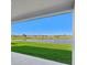 View from patio features a peaceful lake and landscape at 13855 Richland Gulf Cir, Parrish, FL 34219
