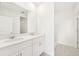 Clean bathroom with double vanity and a shower at 14037 Crutchfield Ct, Parrish, FL 34219
