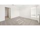 Spacious bedroom with grey carpet and an ensuite bathroom at 14037 Crutchfield Ct, Parrish, FL 34219