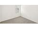 Simple bedroom with carpet and a window at 14037 Crutchfield Ct, Parrish, FL 34219