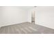 Bright bedroom with grey carpet and access to a bathroom at 14037 Crutchfield Ct, Parrish, FL 34219
