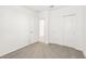 Bright bedroom with grey carpet and an adjacent bathroom at 14037 Crutchfield Ct, Parrish, FL 34219