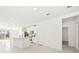 Open concept kitchen with island and white cabinets at 14037 Crutchfield Ct, Parrish, FL 34219