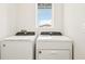 Laundry room with Whirlpool washer and dryer at 14037 Crutchfield Ct, Parrish, FL 34219
