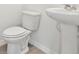 Clean and modern bathroom with pedestal sink and toilet at 14057 Crutchfield Ct, Parrish, FL 34219