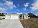 Newly built home features a three-car garage at 2840 S Biscayne Dr, North Port, FL 34287