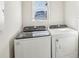 Laundry room with Whirlpool washer and dryer at 3902 Radiant Mountain Dr, Plant City, FL 33565