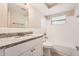Clean bathroom, granite countertop, white vanity, and tub at 3531 Oxford Dr, Holiday, FL 34691