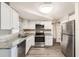 Modern kitchen featuring stainless steel appliances and granite countertops at 3531 Oxford Dr, Holiday, FL 34691