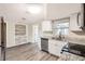 Modern kitchen with stainless steel appliances and granite countertops at 3531 Oxford Dr, Holiday, FL 34691
