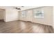 Bright living room with ceiling fan and wood-look flooring at 3531 Oxford Dr, Holiday, FL 34691