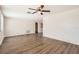 Hardwood floor living room with access to bathroom at 3531 Oxford Dr, Holiday, FL 34691