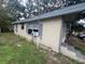 Side view of house showing light yellow siding at 855 St Francis St, Brooksville, FL 34601