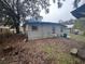 Back of house showing a damaged roof section at 855 St Francis St, Brooksville, FL 34601