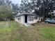Cute yellow house with small front porch at 855 St Francis St, Brooksville, FL 34601