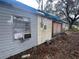 House exterior with a damaged shed at 855 St Francis St, Brooksville, FL 34601