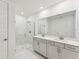 Modern bathroom with double vanity and shower at 13859 Richland Gulf Cir, Parrish, FL 34219