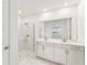 Elegant bathroom with double vanity and walk-in shower at 13859 Richland Gulf Cir, Parrish, FL 34219