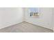 Spacious bedroom with grey carpet and window with blinds at 13859 Richland Gulf Cir, Parrish, FL 34219