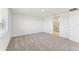 Bright bedroom with gray carpet and en-suite bathroom at 13859 Richland Gulf Cir, Parrish, FL 34219