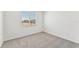 Bright bedroom with grey carpet and window with blinds at 13859 Richland Gulf Cir, Parrish, FL 34219