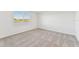 Spacious bedroom with gray carpeting and large window at 13859 Richland Gulf Cir, Parrish, FL 34219
