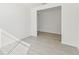Bright bedroom with tile floor and open doorway at 13859 Richland Gulf Cir, Parrish, FL 34219