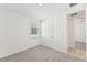 Bedroom with carpet, window, and access to hallway at 13859 Richland Gulf Cir, Parrish, FL 34219