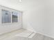 Bright bedroom with tile floor and window with blinds at 13859 Richland Gulf Cir, Parrish, FL 34219