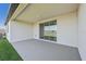 Covered patio with sliding glass doors and view of lake at 13859 Richland Gulf Cir, Parrish, FL 34219