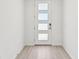 Modern white door with frosted glass panels and light wood-look tile flooring at 13859 Richland Gulf Cir, Parrish, FL 34219