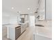 Modern kitchen with stainless steel appliances and an island at 13859 Richland Gulf Cir, Parrish, FL 34219