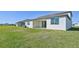Home with covered patio and grassy backyard at 13868 Richland Gulf Cir, Parrish, FL 34219