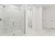 Bright bathroom with walk-in shower, toilet and white tile at 13868 Richland Gulf Cir, Parrish, FL 34219