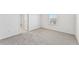 Bright bedroom with carpet and large window at 13868 Richland Gulf Cir, Parrish, FL 34219